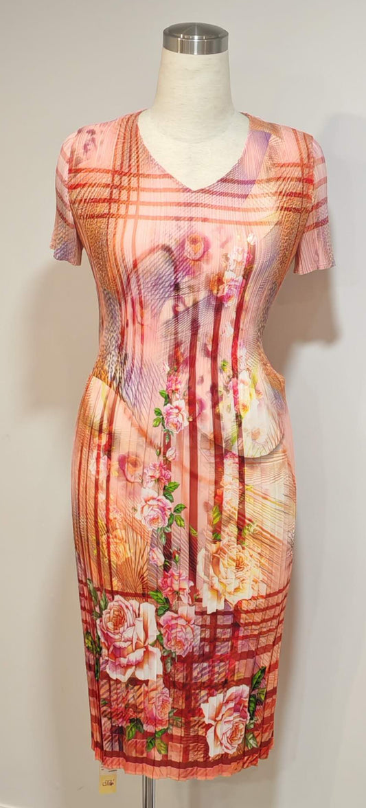 Multicolored dress on a mannequin against a white wall