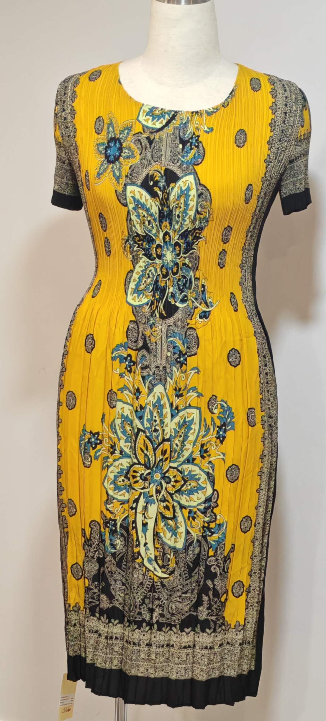 Yellow dress with floral pattern on a mannequin against a white background