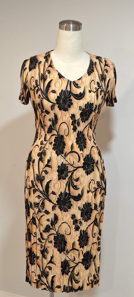 Black floral dress on a mannequin against a white background